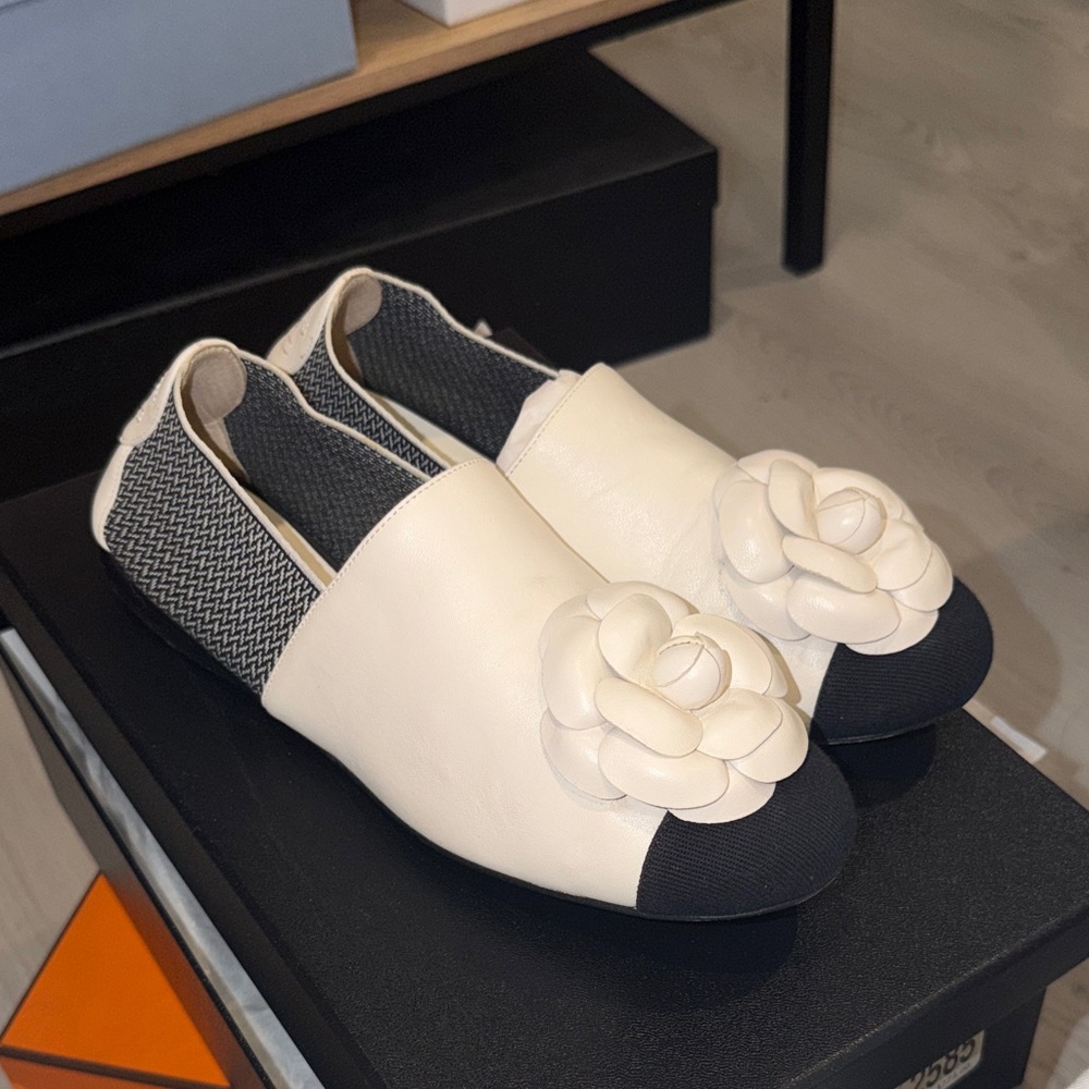 CHANEL Cream and Black Leather Camellia Slip-On Moccasins